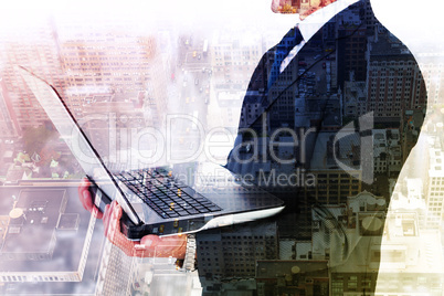 Composite image of businessman with watch using tablet pc Composite image of businessman with watch using tablet pc