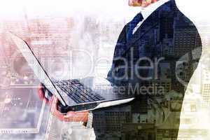 Composite image of businessman with watch using tablet pc