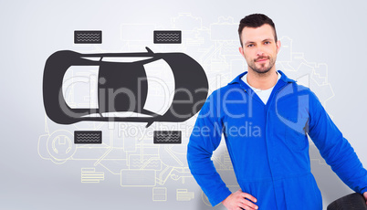 Composite image of smiling male mechanic holding tire