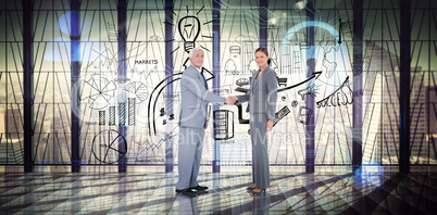 Composite image of business team shaking hands