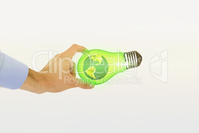 Composite image of businessman holding hand out in presentation