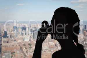 Composite image of woman using inhaler for asthma