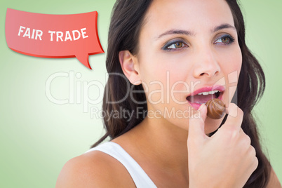 Composite image of pretty brunette eating chocolate candy