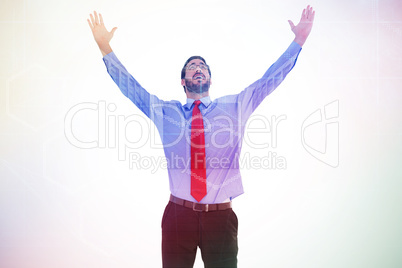 Composite image of happy cheering businessman raising his arms