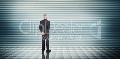 Composite image of businessman standing