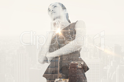 Composite image of thinking asian businesswoman