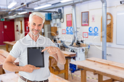 Composite image of mature student showing tablet pc