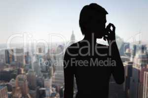 Composite image of blonde woman taking her inhaler
