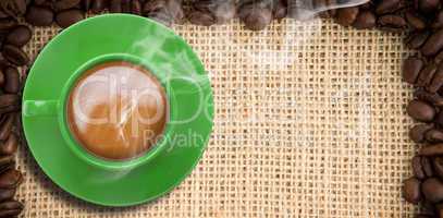 Composite image of green cup of coffee