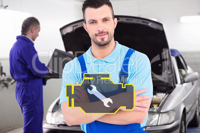 Composite image of male handyman standing arms crossed