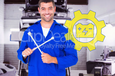 Composite image of smiling male mechanic holding lug wrench