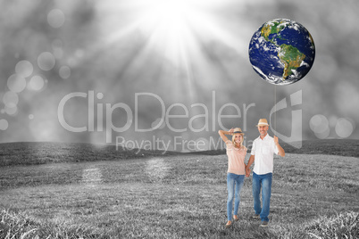 Composite image of happy couple walking holding hands