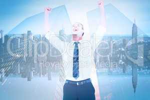 Composite image of handsome businessman cheering with arms up