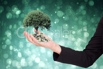 Composite image of businesswomans arm presenting