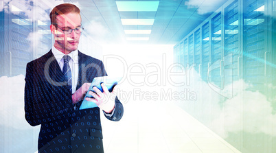 Composite image of unsmiling businessman using tablet pc