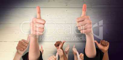 Composite image of hands showing thumbs up