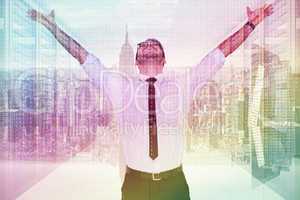 Composite image of cheering businessman with his arms raised up