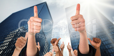 Composite image of hands showing thumbs up