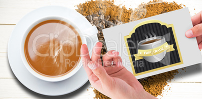 Composite image of hand showing card