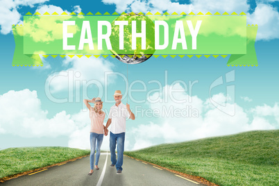 Composite image of happy couple walking holding hands