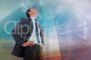 Composite image of cheerful businessman with hands on hips