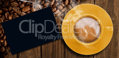 Composite image of yellow cup of coffee