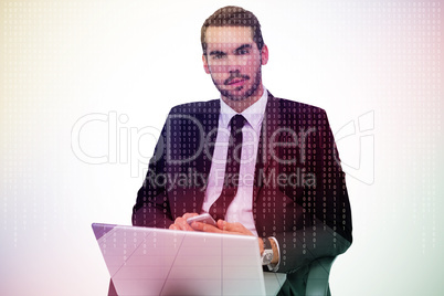 Composite image of cheerful businessman with laptop using smartp