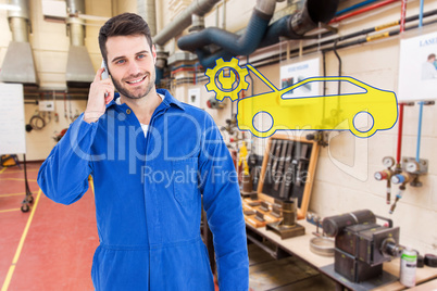 Composite image of smiling male mechanic using mobile phone