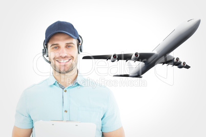 Composite image of hhappy male courier man wearing headset