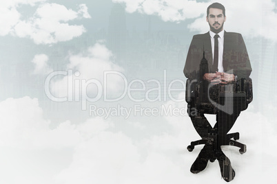 Composite image of stern businessman sitting on an office chair