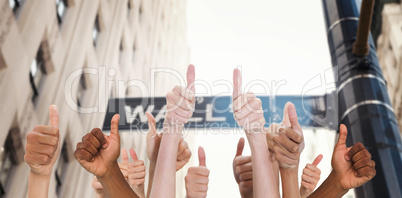 Composite image of hands showing thumbs up