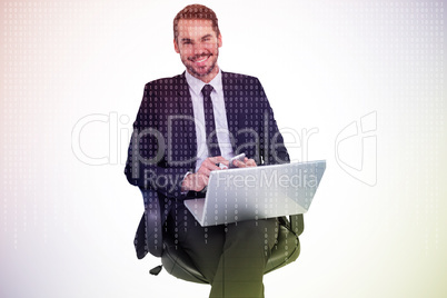 Composite image of happy businessman with laptop using smartphon