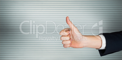 Composite image of hand showing thumbs up