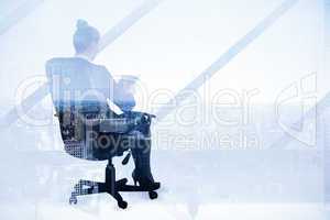 Composite image of businesswoman sitting on swivel chair with ta