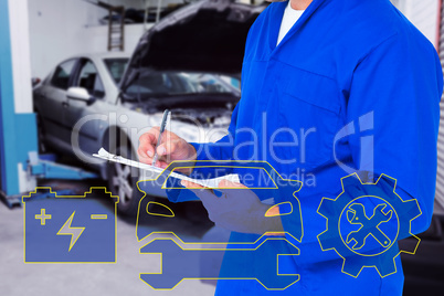 Composite image of midsection of mechanic writing on clipboard