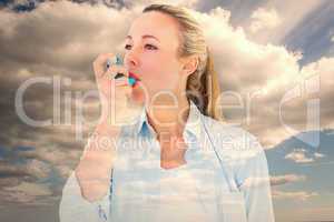 Composite image of pretty blonde using an asthma inhaler