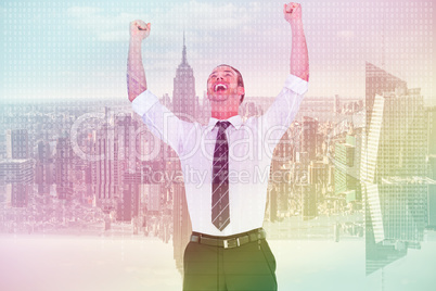 Composite image of handsome businessman cheering with arms up