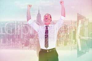 Composite image of handsome businessman cheering with arms up