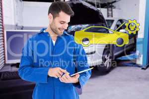 Composite image of male mechanic using digital tablet