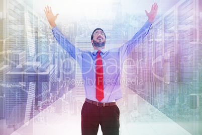 Composite image of happy cheering businessman raising his arms