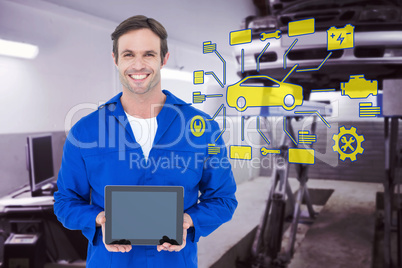 Composite image of happy mechanic holding digital tablet