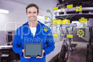 Composite image of happy mechanic holding digital tablet