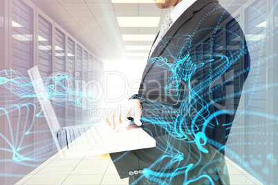 Composite image of businessman holding laptop