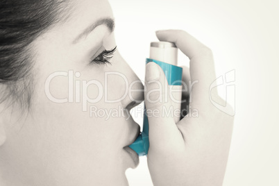 Woman with an asthma inhaler