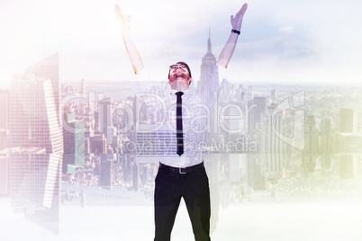 Composite image of smiling businessman cheering with his hands u