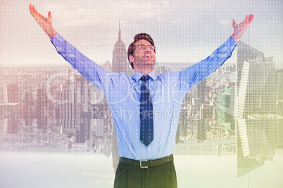 Composite image of cheering businessman with his arms raised up