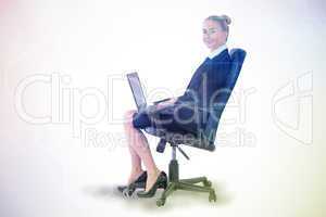 Composite image of businesswoman sitting on swivel chair with la