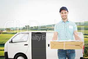 Composite image of handsome courier man with parcel