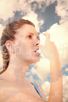 Composite image of woman using inhaler for asthma