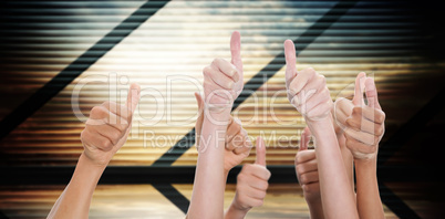 Composite image of hands up and thumbs raised